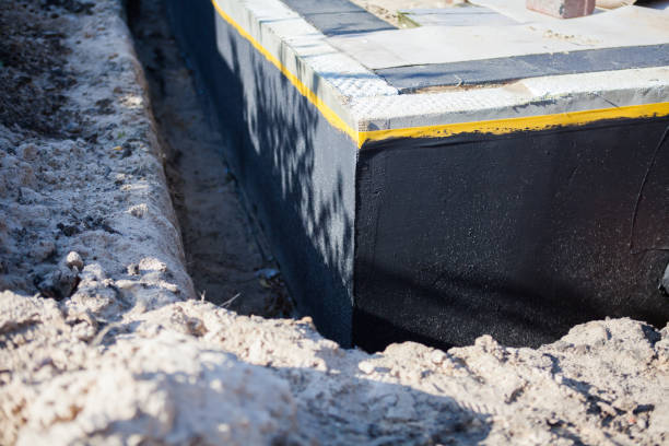 Professional Basement Waterproofing technician working in Reisterstown, MD